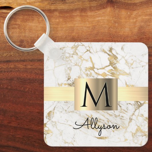 Witte en goudkleurige gouddoos, zwart monogram sleutelhanger (Voorkant)