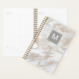 Witte en goudkleurige planner