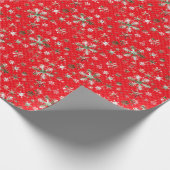 Witte en groene sneeuwvlokken op een rode achtergr cadeaupapier (Hoek)