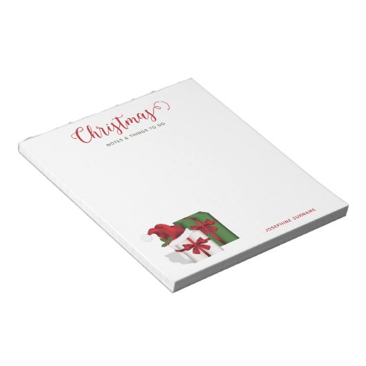 Witte en groene wasdozen met een kersthat notitieblok (Schuin)