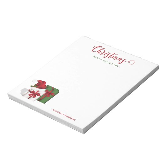 Witte en groene wasdozen met een kersthat notitieblok (Linkerzijde)