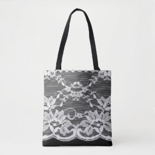Witte florale kant op een zwarte achtergrond. tote bag