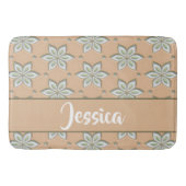 Witte gegraveerde bloemen op bruin badmat (Voorkant)