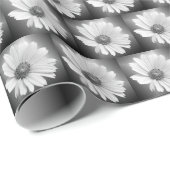 Witte gloeiende madeliefje op zwart cadeaupapier (Rol Hoek)