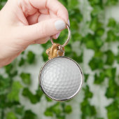 Witte Golfbal met Putjes Textuur Sleutelhanger (Hand)