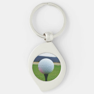 witte Golfbal op een golfbaan in een berg Sleutelhanger