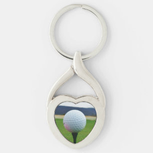 witte Golfbal op een golfbaan in een berg Sleutelhanger