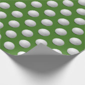witte golfbal op groen cadeaupapier (Hoek)