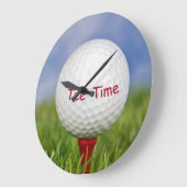 witte golfbal op rood t-shirt grote klok (Hoek)