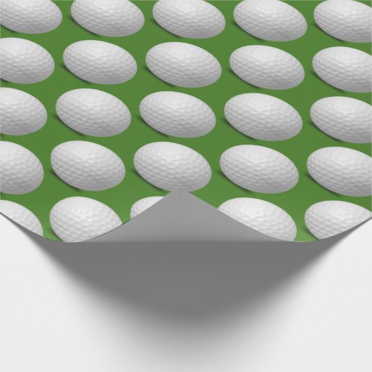 witte golfballen op groen cadeaupapier (Hoek)
