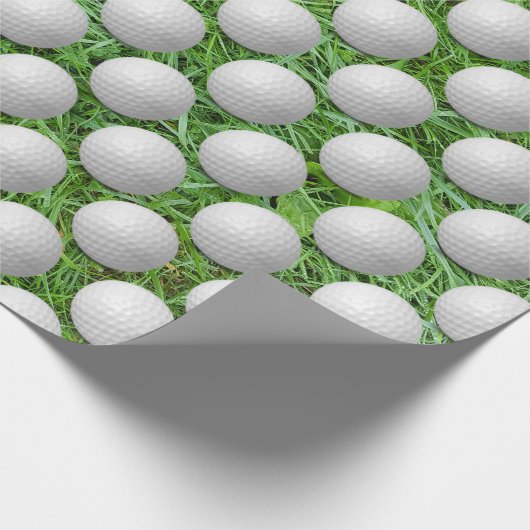 Witte golfballen op groen gras cadeaupapier (Hoek)