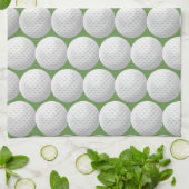 witte golfballen op groen theedoek (Gevouwen)