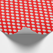 Witte golfballen op rood cadeaupapier (Hoek)
