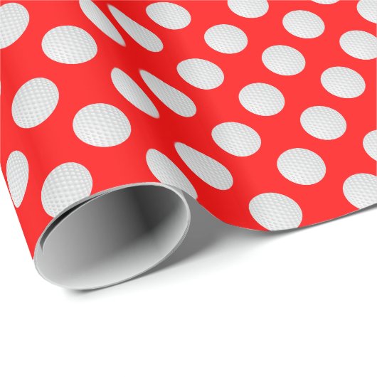 Witte golfballen op rood cadeaupapier (Rol Hoek)
