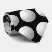 witte golfballen op zwart stropdas (Opgerold)