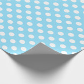 Witte haarpunten op bleek blauw cadeaupapier (Hoek)