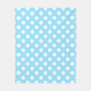 Witte haarpunten op bleek blauw fleece deken