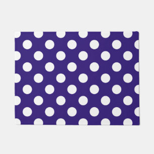 Witte haarvlekken op donkerblauw deurmat