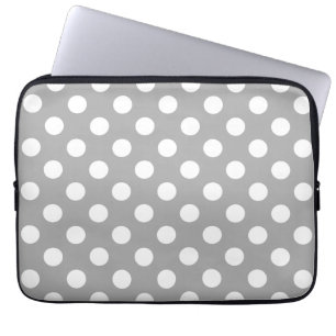 Witte haarvlekken op grijs laptop sleeve