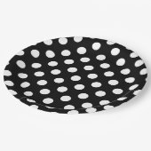 Witte haarvlekken op zwart papieren bordje (Gekanteld)