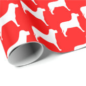 Witte hond op rood cadeaupapier (Rol Hoek)
