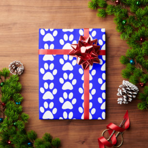 Witte honden/katten/dierenpootafdrukken op blauw cadeaupapier