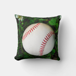Witte honkbal met rode stiksels kussen
