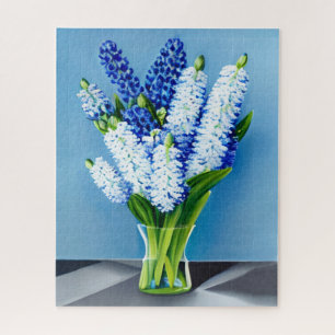 Witte hyacinten in een glazen vaas op blauw legpuzzel