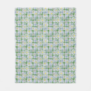 Witte kamille bloemen op een groen blauw geruit fleece deken