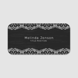 Witte kant op zwart naamplaatje