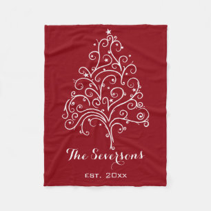 Witte kerstboom op rood fleece deken