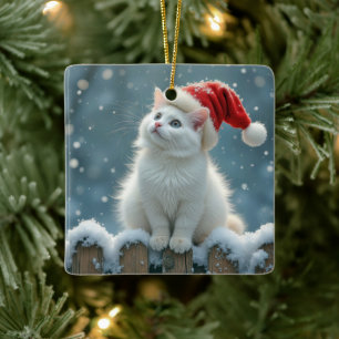 Witte kerstkat op een hek keramisch ornament