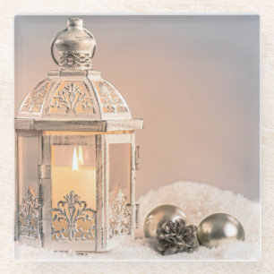 Witte kerstlantaarn en sierplanten glazen onderzetter