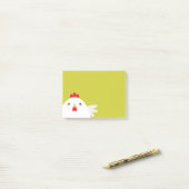 Witte kip op groen post-it® notes (Op bureau)