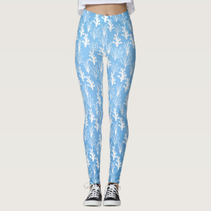 Witte koralen met bomen op blauwe achtergrond leggings