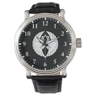 Witte kraanvogels tegenover elkaar horloge