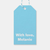 Witte kruisstiften op babyblauw cadeaulabel (Achterkant)