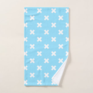 Witte kruisstiften op babyblauw handdoek