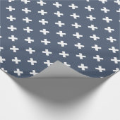 Witte kruisstiften op blauwe grijs cadeaupapier (Hoek)