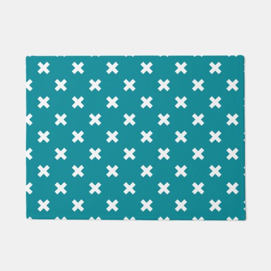 Witte kruisstiften op blauwgroen deurmat (Voorkant)