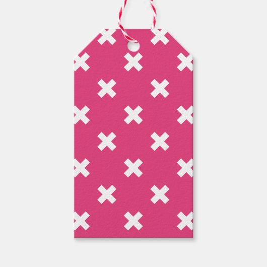 Witte kruisstiften op fuchsia cadeaulabel (Voorkant)