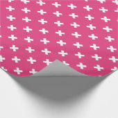 Witte kruisstiften op fuchsia cadeaupapier (Hoek)
