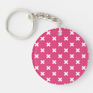 Witte kruisstiften op fuchsia sleutelhanger
