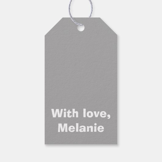 Witte kruisstiften op grijs cadeaulabel (Achterkant)