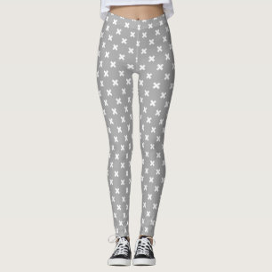 Witte kruisstiften op grijs leggings