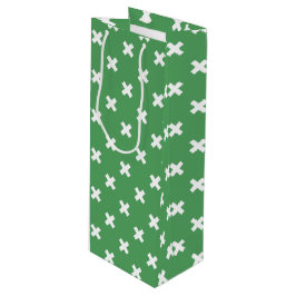 Witte kruisstiften op groen wijn cadeautas