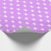 Witte kruisstiften op lila cadeaupapier (Hoek)
