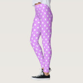 Witte kruisstiften op lila leggings (Links)