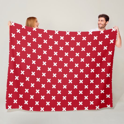 Witte kruisstiften op rood fleece deken (In situ)