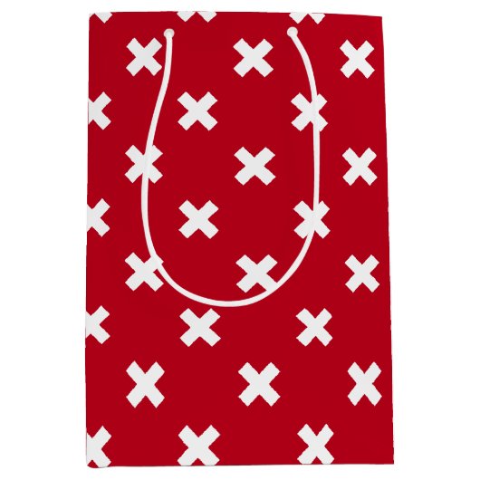 Witte kruisstiften op rood medium cadeauzakje (Voorkant)